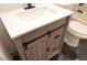 Bathroom vanity featuring light wood, white countertop and modern black hardware at 7413 Red Eagle St, Las Vegas, NV 89131