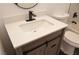 Bathroom vanity featuring light wood, white countertop and modern black faucet at 7413 Red Eagle St, Las Vegas, NV 89131
