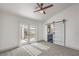 Bedroom features carpet, a ceiling fan, and door that leads to a private patio at 7413 Red Eagle St, Las Vegas, NV 89131