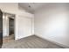 A bedroom featuring neutral carpeting, white walls, and closet with sliding doors at 7413 Red Eagle St, Las Vegas, NV 89131