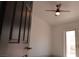 Bedroom featuring a ceiling fan and glass patio doors at 7413 Red Eagle St, Las Vegas, NV 89131