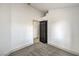 The bedroom boasts neutral carpeting, white walls, and an open view to an adjacent room at 7413 Red Eagle St, Las Vegas, NV 89131
