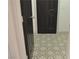 Hallway featuring new stylish flooring leading to a painted door at 7413 Red Eagle St, Las Vegas, NV 89131