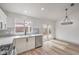 Bright kitchen area leading to a serene backyard patio, featuring stainless appliances and modern countertops at 7413 Red Eagle St, Las Vegas, NV 89131