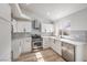 Eat-in kitchen with stainless steel appliances, bright lighting, and modern cabinetry at 7413 Red Eagle St, Las Vegas, NV 89131