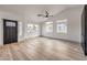 Bright living room with wood floors, and large windows to bring in natural light at 7413 Red Eagle St, Las Vegas, NV 89131