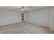 Comfortable bedroom with neutral tones and a view into the laundry room at 9017 Wolf Dancer Ave, Las Vegas, NV 89143