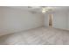 Expansive bedroom with neutral carpet and walls, bathed in natural light at 9017 Wolf Dancer Ave, Las Vegas, NV 89143