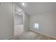 Bonus room with neutral walls, carpet, natural light, and a peek into an adjacent bedroom at 9017 Wolf Dancer Ave, Las Vegas, NV 89143