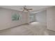 Spacious upstairs bonus room with neutral carpet and natural light at 9017 Wolf Dancer Ave, Las Vegas, NV 89143