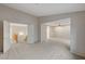Upstairs bonus room with neutral carpet and a bright, open floor plan at 9017 Wolf Dancer Ave, Las Vegas, NV 89143