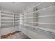 Large walk-in closet boasts custom shelving for optimal storage and organization at 9017 Wolf Dancer Ave, Las Vegas, NV 89143