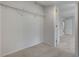 A carpeted walk-in closet with white walls and a wire rack shelf provides ample storage space at 9017 Wolf Dancer Ave, Las Vegas, NV 89143