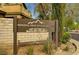 A sign for Spring Mountain Ranch against a brick wall and greenery at 9017 Wolf Dancer Ave, Las Vegas, NV 89143