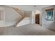 Open foyer with tile floors, staircase, and large windows for natural light at 9017 Wolf Dancer Ave, Las Vegas, NV 89143