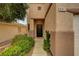 Close up view of the front entrance, showing the front door and landscaping at 9017 Wolf Dancer Ave, Las Vegas, NV 89143