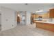 Open-concept kitchen with stainless appliances, plenty of counter space, and easy access to the second floor at 9017 Wolf Dancer Ave, Las Vegas, NV 89143