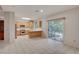Bright kitchen boasts stainless steel appliances, a breakfast bar, and seamless access to the outdoors at 9017 Wolf Dancer Ave, Las Vegas, NV 89143