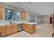Bright kitchen with stainless steel appliances, wood cabinetry, and a breakfast bar for a modern touch at 9017 Wolf Dancer Ave, Las Vegas, NV 89143