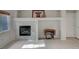 Cozy living room with a tiled fireplace and niche, perfect for displaying your favorite decor at 9017 Wolf Dancer Ave, Las Vegas, NV 89143