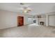 Open concept living room with fireplace, tile flooring, and lots of natural light at 9017 Wolf Dancer Ave, Las Vegas, NV 89143