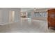 Bright living room boasts tile floors, neutral paint, and an open layout great for entertaining at 9017 Wolf Dancer Ave, Las Vegas, NV 89143