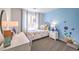 Bright bedroom featuring a twin bed, white furniture, gray carpet and whimsical wall decorations at 4755 Bluebird Cliffs Ave Dr # Lot 173, Las Vegas, NV 89141