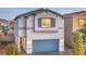 Charming two-story home featuring a two-car garage, and a gray exterior with blue accents at 4755 Bluebird Cliffs Ave Dr # Lot 173, Las Vegas, NV 89141
