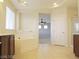 Bathroom showcasing tile flooring, a soaking tub, vanity and a ceiling fan at 1004 Windy Ferrell Ave, North Las Vegas, NV 89081
