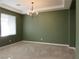 This airy dining room features a modern chandelier and ample natural light at 1004 Windy Ferrell Ave, North Las Vegas, NV 89081