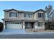 Charming two-story home featuring a two-car garage and well-maintained front yard at 1004 Windy Ferrell Ave, North Las Vegas, NV 89081