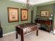 This game room features a foosball table and elegant decor, perfect for entertaining at 1004 Windy Ferrell Ave, North Las Vegas, NV 89081