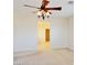 Bright living room features neutral walls, a ceiling fan and doorway to adjoining room at 1004 Windy Ferrell Ave, North Las Vegas, NV 89081