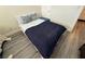 Cozy bedroom featuring a neatly made bed, hardwood floors, and ample natural light at 10071 Lemon Valley Ave, Las Vegas, NV 89147