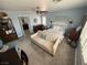 Spacious bedroom with a sitting couch, dresser and bright windows at 10071 Lemon Valley Ave, Las Vegas, NV 89147