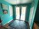 Bright dining area with sliding door access to the backyard, hardwood floors, and modern light fixture at 10071 Lemon Valley Ave, Las Vegas, NV 89147