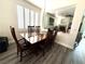 Inviting dining room with a wooden table, seating for six, and natural light at 10071 Lemon Valley Ave, Las Vegas, NV 89147