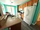 Bright kitchen with oak cabinets, stainless appliances, hardwood floors, and a double stainless sink at 10071 Lemon Valley Ave, Las Vegas, NV 89147