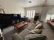 Spacious living room with comfortable seating, natural light, and ample storage for a relaxed atmosphere at 10071 Lemon Valley Ave, Las Vegas, NV 89147