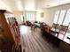 Inviting living room and dining area featuring hardwood floors, stylish furniture, and natural light at 10071 Lemon Valley Ave, Las Vegas, NV 89147