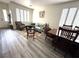 Bright living room with hardwood floors, large windows, and comfortable seating at 10071 Lemon Valley Ave, Las Vegas, NV 89147