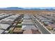 Aerial view of community featuring many homes, a street, and desert landscape at 10095 Ferton Lake Ave, Las Vegas, NV 89178