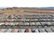 An aerial view of a community of single-Gathering homes featuring similar floor plans and desert landscaping at 10095 Ferton Lake Ave, Las Vegas, NV 89178
