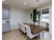 Dining room with modern table and chairs next to a sliding glass door at 10095 Ferton Lake Ave, Las Vegas, NV 89178