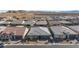 Front aerial view of home showcasing the gray roof and well-manicured landscaping at 10095 Ferton Lake Ave, Las Vegas, NV 89178
