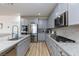 Spacious kitchen featuring stainless appliances, granite countertops, and ample cabinet space at 10095 Ferton Lake Ave, Las Vegas, NV 89178