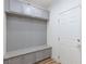 Mudroom featuring beadboard, granite bench, and cabinets for organized storage at 10095 Ferton Lake Ave, Las Vegas, NV 89178