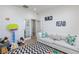 Inviting playroom with cozy white sofa, toys, and Chevron rug for playtime fun at 10095 Ferton Lake Ave, Las Vegas, NV 89178