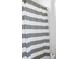 Shower features a gray and white striped curtain at 10095 Ferton Lake Ave, Las Vegas, NV 89178