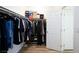 Walk-in closet with clothes, shelves and shoe storage at 10095 Ferton Lake Ave, Las Vegas, NV 89178